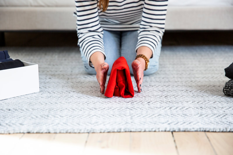 Michele Delory featuring the KonMari folding technique with a vertical standing fold.